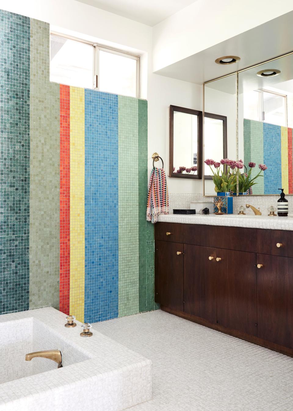 A colorful hand towel sourced from Amazon ties in the playful pattern of the tiles. But the play on tile doesn’t stop there. “I love this tile so much, and so because I’m insane, I bought a vintage Dior bathrobe to match,” Colman jokes.