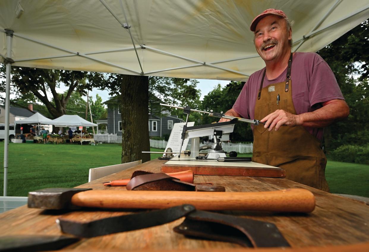 Knife sharpener David Morrison sets up shop at the Holden Farmers Market.