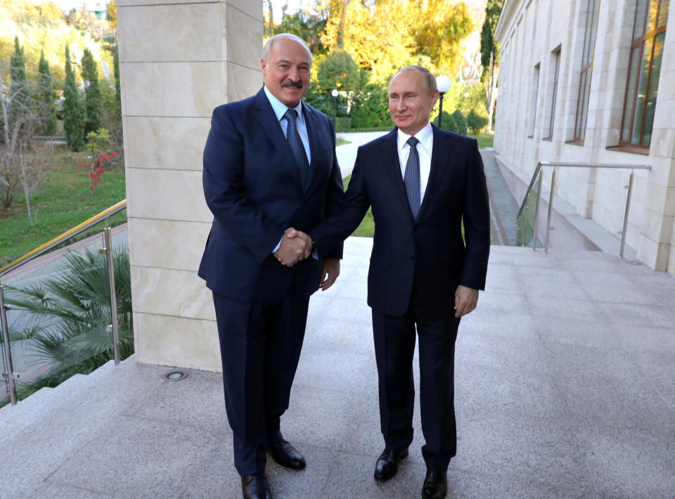 Russian President Vladimir Putin, right, and Belarusian President Alexander Lukashenko shake hands during their meeting in the Black sea resort of Sochi, Russia, Saturday, Dec. 7, 2019. Leaders of Russia and Belarus sat down for talks Saturday on deepening ties between the two allies — a meeting that triggered a protest in the Belarusian capital. More than 1,000 opposition demonstrators rallied in Minsk to protest closer integration with Russia, which they fear could erode the post-Soviet independence of the nation of 10 million. (Mikhail Klimentyev, Sputnik, Kremlin Pool Photo via AP)