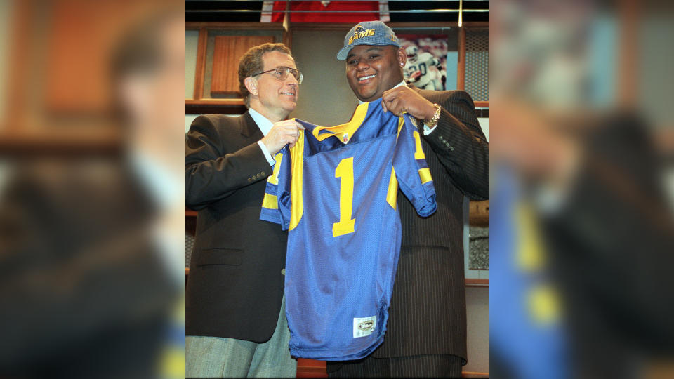 Mandatory Credit: Photo by Kevin Larkin/AP/Shutterstock (6032871a)PACE TAGLIABUE Orlando Pace, right, Ohio State's massive tackle, holds a St.