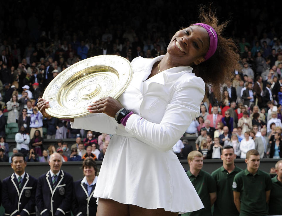 USA's Serena Williams celebrates with her trophy after defeating Poland's Agnieszka Radwanska in the Ladies Singles Final during day twelve of the 2012 Wimbledon Championships at the All England Lawn Tennis Club, Wimbledon. (Photo by Rebecca Naden/PA Images via Getty Images)