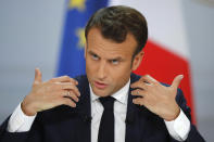 French President Emmanuel Macron delivers a speech at the Elysee Palace Thursday, April 25, 2019 in Paris. Macron makes a speech at the Elysee presidential palace based on three months of national debate aimed at addressing the protesters' concerns through town hall meetings and collecting complaints online. (AP Photo/Michel Euler)