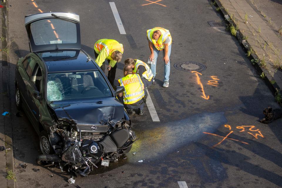 Police officers and forensic experts secure evidences at the site where a motorcycle crashed with a car, probably the car used by an alleged offender to cause several accidents on the A 100 highway in Berlin on August 19, 2020. - A man caused a series of motorway accidents in Berlin on Tuesday night, injuring six people including three seriously in what German prosecutors have described as an Islamist act. (Photo by Odd ANDERSEN / AFP) (Photo by ODD ANDERSEN/AFP via Getty Images)