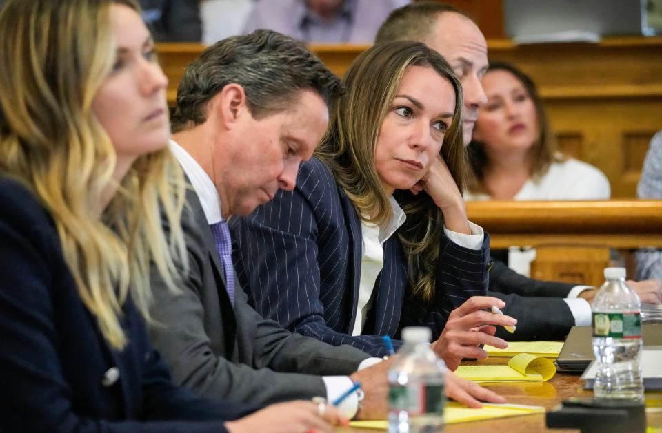 Karen Read, center right, sits Monday, June 10, 2024, at Norfolk Super Court in Dedham, Massachusetts, during her trial on charges related to the 2022 death of her boyfriend, Boston police officer John O. 'Keefe.  (Kayla Bartkowski/The Boston Globe via AP, Pool)