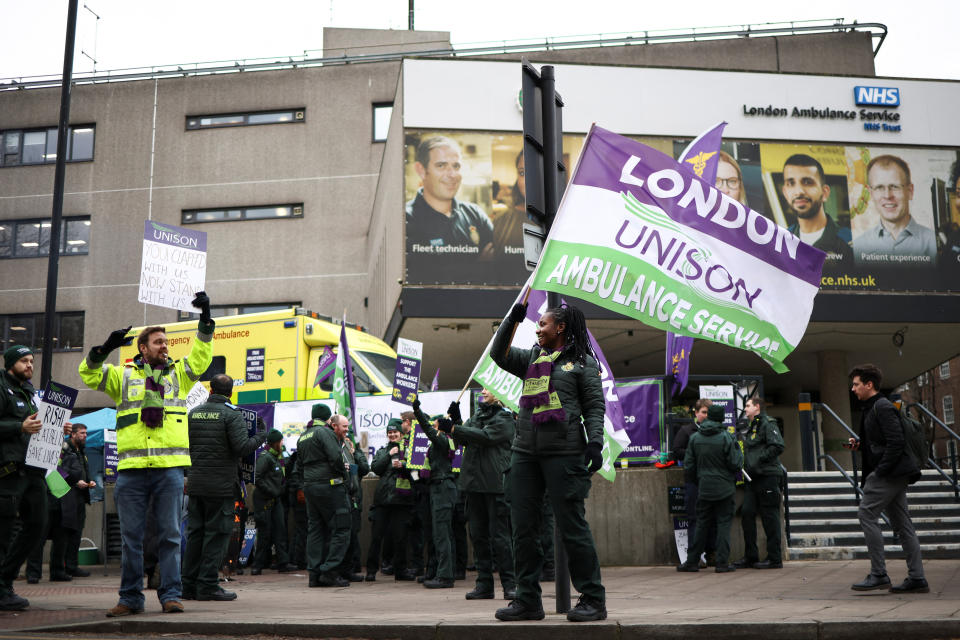 People protest in front of the London Ambulance Service during a strike by ambulance workers due to a dispute with the government over pay, in London, Britain January 23, 2023. REUTERS/Henry Nicholls