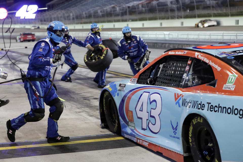 Bubba Wallace (43) makes a pit stop during a NASCAR Cup Series auto race Sunday, June 14, 2020, in Homestead, Fla. (AP Photo/Wilfredo Lee)