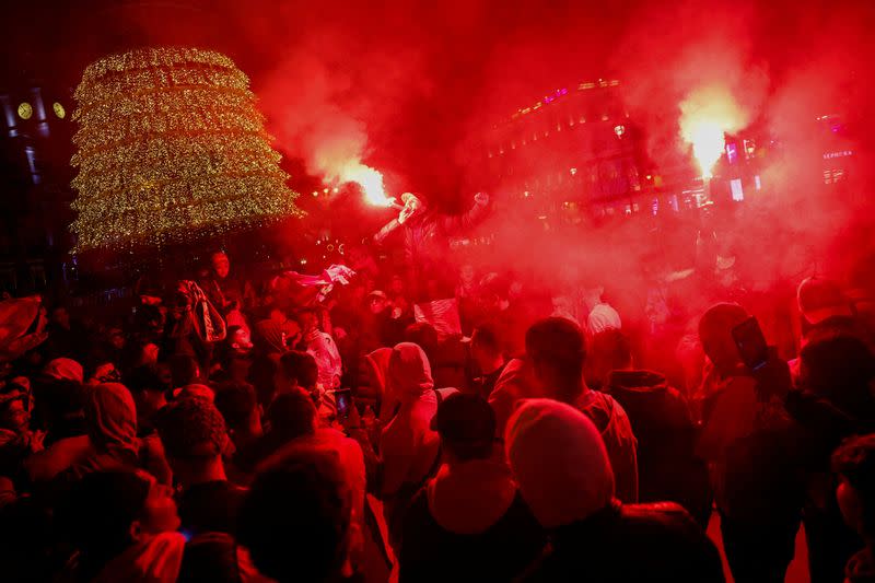 Morocco fans celebrate as they gather in Sol square after the FIFA World Cup Qatar 2022 match between Spain and Morocco, in Madrid