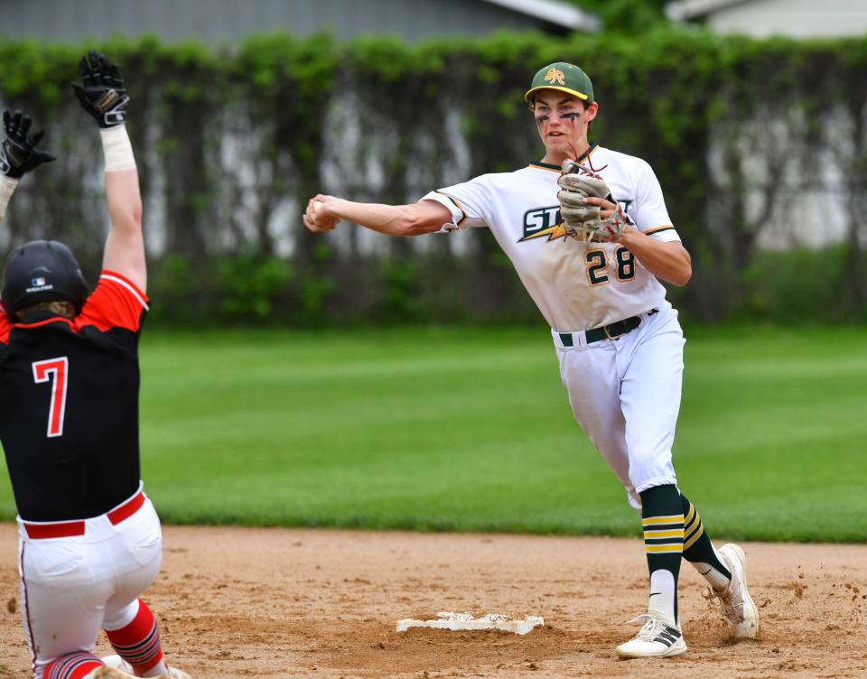 Terrence Moody of Sauk Rapids tries to turn a double play as ROCORI's Peyton Randall slides into second during the game Tuesday, May 31, 2022, in Cold Spring.