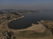 An aerial view of Villa Victoria Dam, the main water supply for Mexico City residents, on the outskirts of Toluca, Mexico Thursday, April 22, 2021. Drought conditions now cover 85% of Mexico, and in areas around Mexico City and Michoacán, the problem has gotten so bad that lakes and reservoirs are drying up. (AP Photo/Fernando Llano)