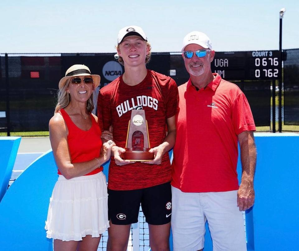 Ethan Quinn of Georgia poses for a photo with the singles champion trophy after winning the 2023 NCAA Division I men’s tennis championships at the USTA National Campus in Orlando, Florida on Saturday, May 27, 2023.