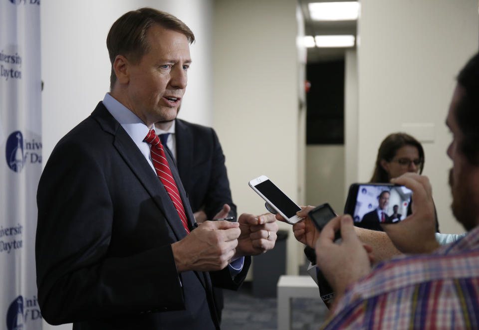 Ohio Democratic gubernatorial candidate Richard Cordray, left, speaks in the spin room following a debate against Ohio Attorney General and Republican gubernatorial candidate Mike DeWine at the University of Dayton Wednesday, Sept. 19, 2018, in Dayton, Ohio. (AP Photo/Gary Landers)