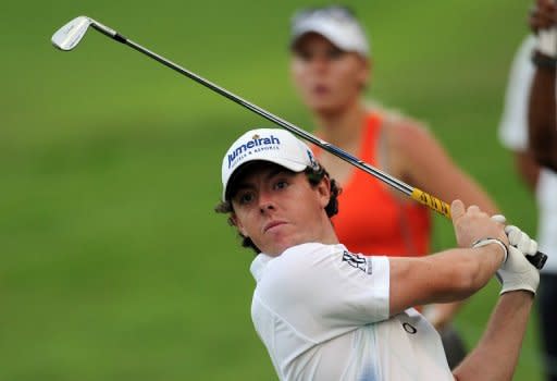 This handout photo, provided by World Sport Group on November 9, shows Rory McIlroy of Northern Ireland hitting a shot during day two of the Barclays Singapore Open golf tournament at the Sentosa Golf Club in Singapore. McIlroy admitted he was struggling with a cold after completing his rain-interrupted first round five strokes off the pace at the $6 mln event