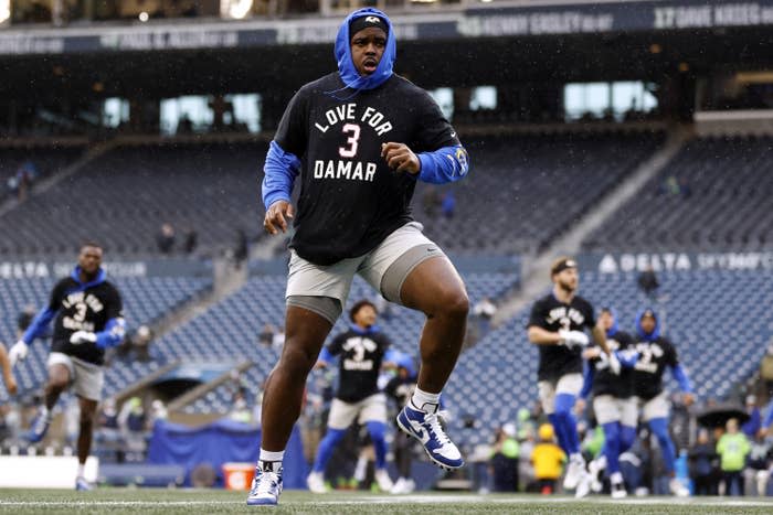 Los Angeles Rams players wear shirts honoring Damar Hamlin, No. 3 of the Buffalo Bills, as they warm up prior to the game Jan. 8, 2023, in Seattle.