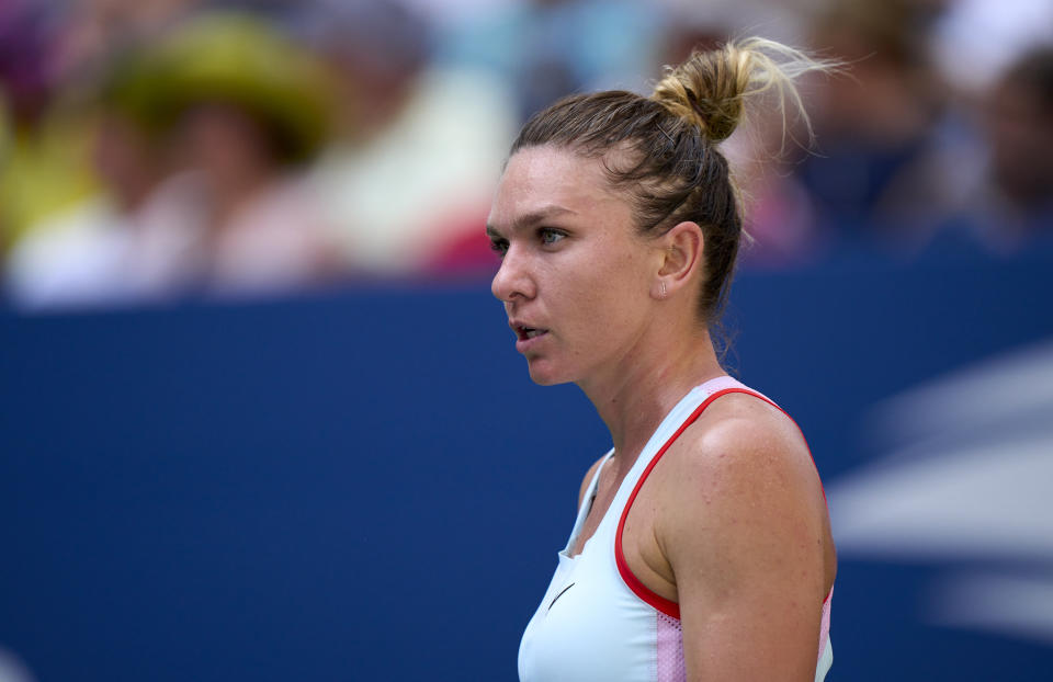 NEW YORK, NEW YORK - AUGUST 29: Simona Halep of Romania looks on against Daria Snigur of Ukraine during the Women&#39;s Singles First Round on Day One of the 2022 US Open at USTA Billie Jean King National Tennis Center on August 29, 2022 in the Flushing neighborhood of the Queens borough of New York City. (Photo by Diego Souto/Quality Sport Images/Getty Images)