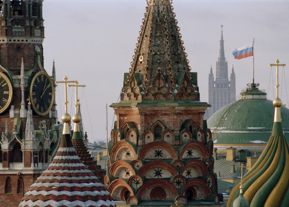 FILE - The Russian flag flies over the Kremlin between the spires of St. Basil's Cathedral in Moscow, on Thursday, Dec. 26, 1991. After Soviet President Mikhail Gorbachev stepped down on Dec. 25, 1991, people strolling across Moscow's snowy Red Square on the evening of Dec. 25 were surprised to witness one of the 20th century’s most pivotal moments — the Soviet red flag over the Kremlin pulled down and replaced with the Russian Federation's tricolor. (AP Photo/Alexander Zemlianichenko, File)