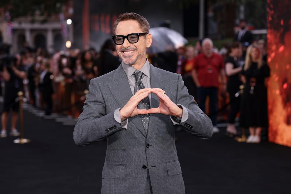 Robert Downey Jr. poses for photographers at the premiere for "Oppenheimer" on Thursday before the actors strike went into effect.