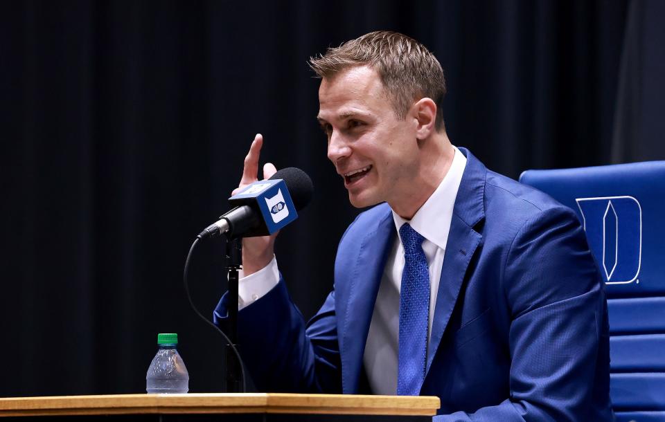 Jon Scheyer speaks after being named the 20th coach of the Duke men's basketball team during a news conference at Cameron Indoor Stadium.