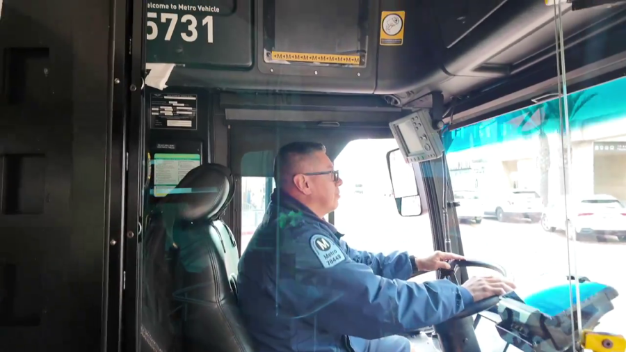 Video from LA Metro shows a bus driver behind a full plexiglass barrier that is larger and offers more cover than current barriers installed in 2020. (LA Metro)