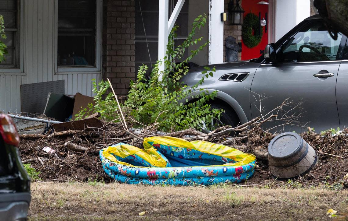 Debris around a yard along Fincher Road on Tuesday, Aug. 23, 2022, in Haltom City. The area flooded after it rained more than 9 inches.
