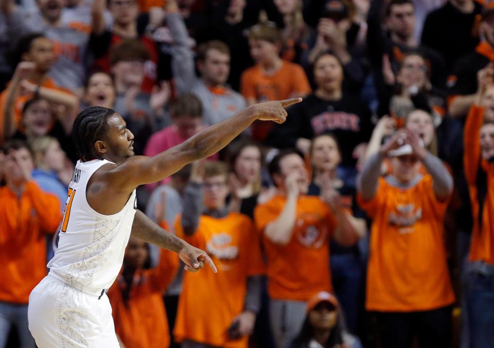 Oklahoma State's John-Michael Wright celebrates a 3-point basket during the Cowboys' game against TCU on Saturday at Gallagher-Iba Arena in Stillwater.