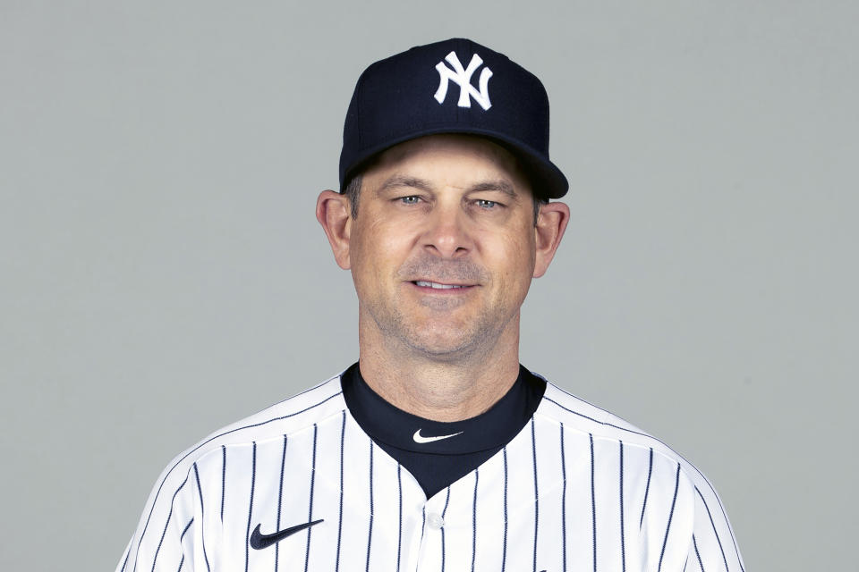 FILE - This is a Feb. 24, 2021, photo showing Aaron Boone of the New York Yankees baseball team. The New York Yankees announced Wednesday, March 3, 2021, that manager Aaron Boone is taking an immediate medical leave of absence to receive a pacemaker. (Mike Carlson/MLB Photos via AP, Pool)