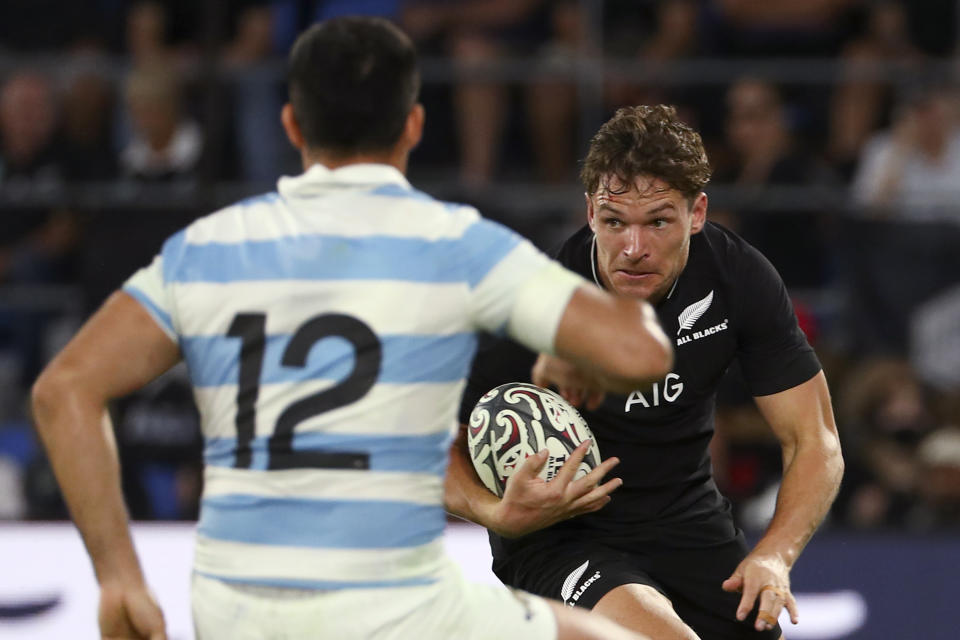 New Zealand's George Bridge, right, looks to get past Argentina's Jeronimo de la Fuente during their Rugby Championship match on Sunday, Sept. 12, 2021, on the Gold Coast, Australia. (AP Photo/Tertius Pickard)