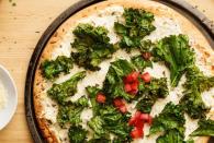 <p>Even though it's covered in gooey cheese, you'll feel like you're getting a full serving of veggies in this green, kale-topped pie.</p><p>Get the <a href="https://www.delish.com/uk/cooking/recipes/a30725789/crispy-kale-white-pizza-recipe-ghk1013/" rel="nofollow noopener" target="_blank" data-ylk="slk:Crispy Kale White Pizza;elm:context_link;itc:0;sec:content-canvas" class="link ">Crispy Kale White Pizza</a> recipe. </p>