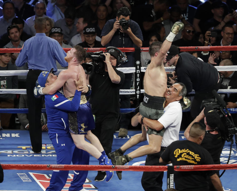 Canelo Alvarez, left, and Gennady Golovkin celebrate following a middleweight title fight Sunday, Sept. 17, 2017, in Las Vegas. The fight was called a draw. (AP)