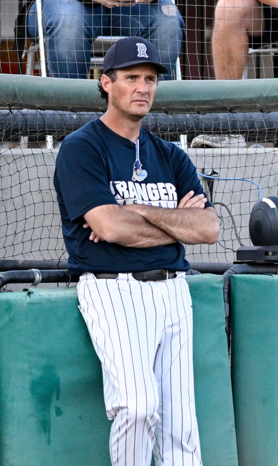 Redwood pitching coach Adam Pettyjohn watches the game against Mt. Whitney in an East Yosemite League high school baseball game at Valley Strong Ballpark on Friday, April 19, 2024.