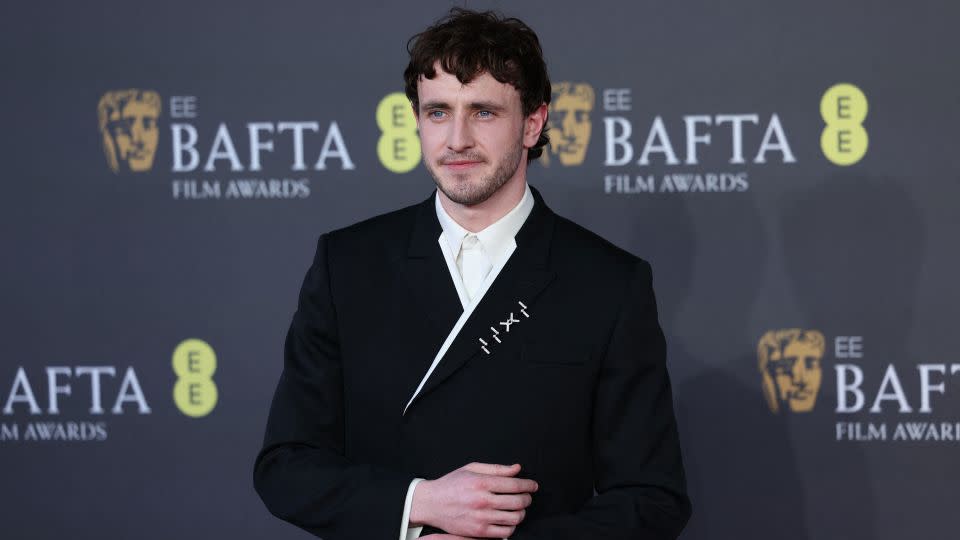 Paul Mescal in a black suit with white embellishment and Cartier jewelry - Isabel Infantes/Reuters