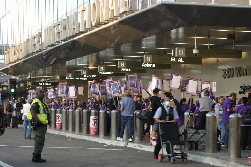 Workers with SEIU Local 721 - Southern California Public Service Workers join a picket line at Los Angeles International Airport on Tuesday, Aug. 8, 2023. Thousands of Los Angeles city employees, including sanitation workers, engineers and traffic officers, walked off the job for a 24-hour strike alleging unfair labor practices. (AP Photo/Damian Dovarganes)