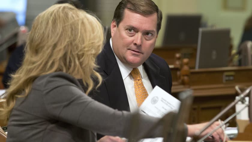 Assemblyman William Brough, R-Dana Point, right, talks with Marie Waldron, R-Escondido, Tuesday, Aug. 30, 2016, in Sacramento, Calif. Lawmakers are working through hundreds of bills as they try to complete their work before the end of the two-year legislative session on Aug. 31. (AP Photo/Rich Pedroncelli)