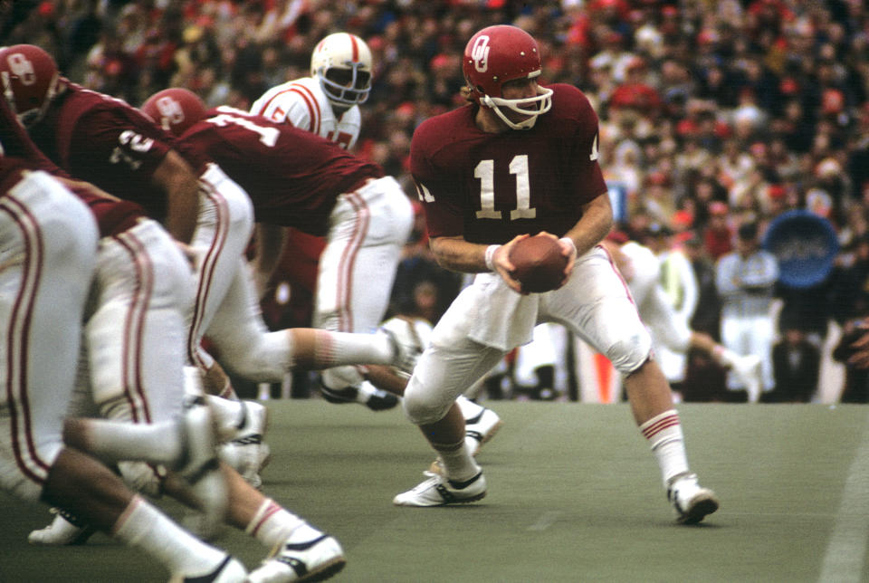 Nov. 25, 1971; Norman; Oklahoma Sooners quarterback Jack Mildren (11) carries the ball against the Nebraska Cornhuskers at Memorial Stadium. The Cornhuskers beat the Sooners 35-31. Malcolm Emmons-USA TODAY Sports