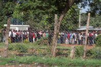 People wait in line to receive money during a primaries election event in the city of Kisumu, Kenya April 20, 2017. REUTERS/Baz Ratner