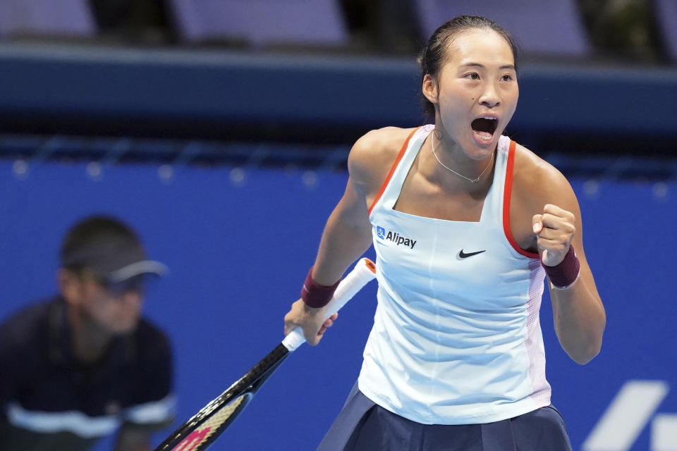 Zheng Qinwen of China reacts after scoring a point against Claire Liu of the U.S. during a singles quarterfinal match in the Pan Pacific Open tennis tournament at Ariake Colosseum Friday, Sept. 23, 2022, in Tokyo. (AP Photo/Eugene Hoshiko)
