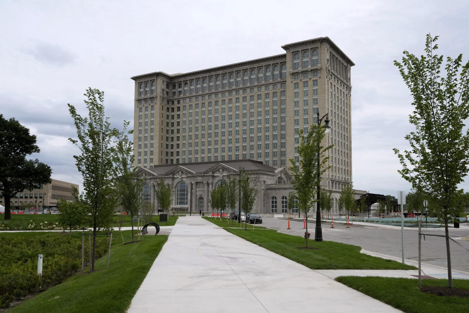 Michigan Central Station is shown, July 13, 2023, in Detroit. On July 18, 2013, a state-appointed manager made Detroit the largest U.S. city to file for bankruptcy. A decade later, the Motor City has risen from the ashes of insolvency, with balanced budgets, revenue increases and millions of dollars socked away. Corktown, a neighborhood just east of downtown, got a boost in 2018 when Ford Motor Co. bought and began renovating the train station, which for years was a symbol of the city's blight. The building will be part of a campus focusing on autonomous vehicles. (AP Photo/Carlos Osorio)