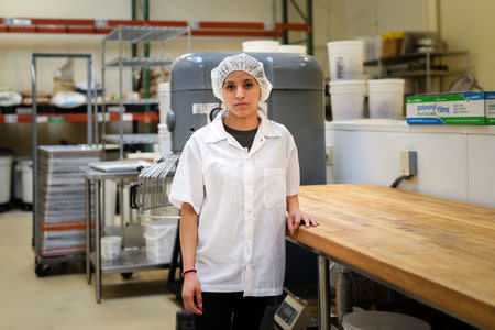 Liliana Barrios poses for a photo at her place of employment in Redwood City, California, U.S., October 10, 2018. REUTERS/Elijah Nouvelage