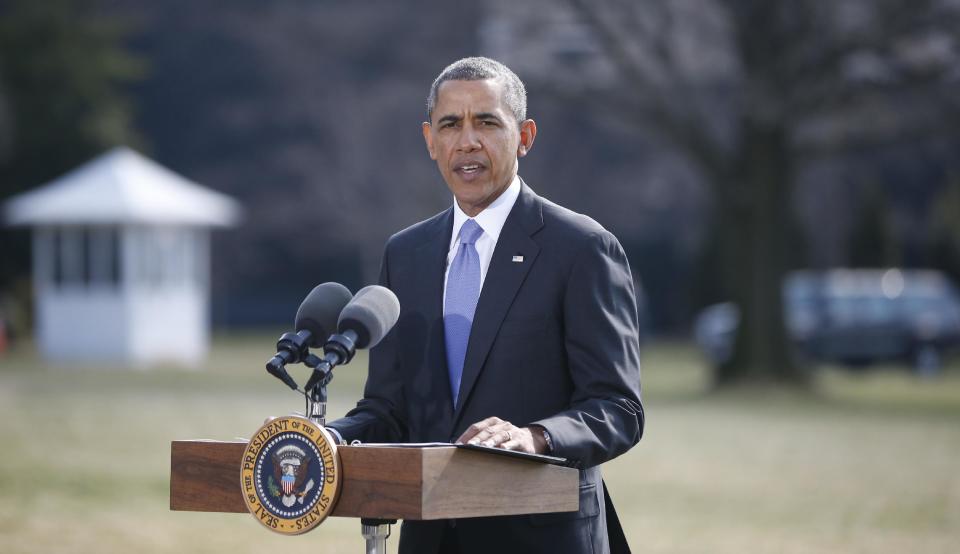 President Barack Obama makes a statement on Ukraine, Thursday, March 20, 2014, on the South Lawn at the White House in Washington before departing for Florida. President Barack Obama said the US is levying a new round of economic sanctions on individuals in Russia, both inside and outside the government, in retaliation for the Kremlin's actions in Ukraine. He also said he has also signed a new executive order that would allow the U.S. to sanction key sectors of the Russian economy. (AP Photo/Charles Dharapak)