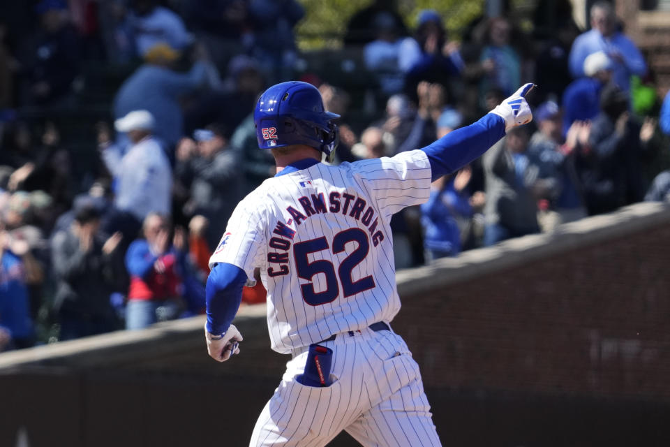 Chicago Cubs' Pete Crow-Armstrong points as he rounds the bases after hitting a two-run home run during the sixth inning of a baseball game against the Houston Astros in Chicago, Thursday, April 25, 2024. (AP Photo/Nam Y. Huh)