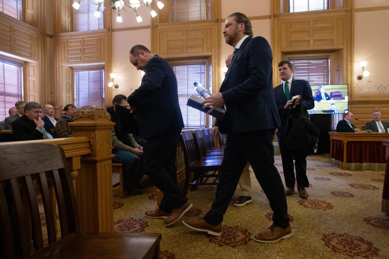 TC Energy's Gary Salsman walks out with lobbyists and associates following Tuesday's Energy, Utilities and Telecommunications meeting at the Kansas Statehouse.