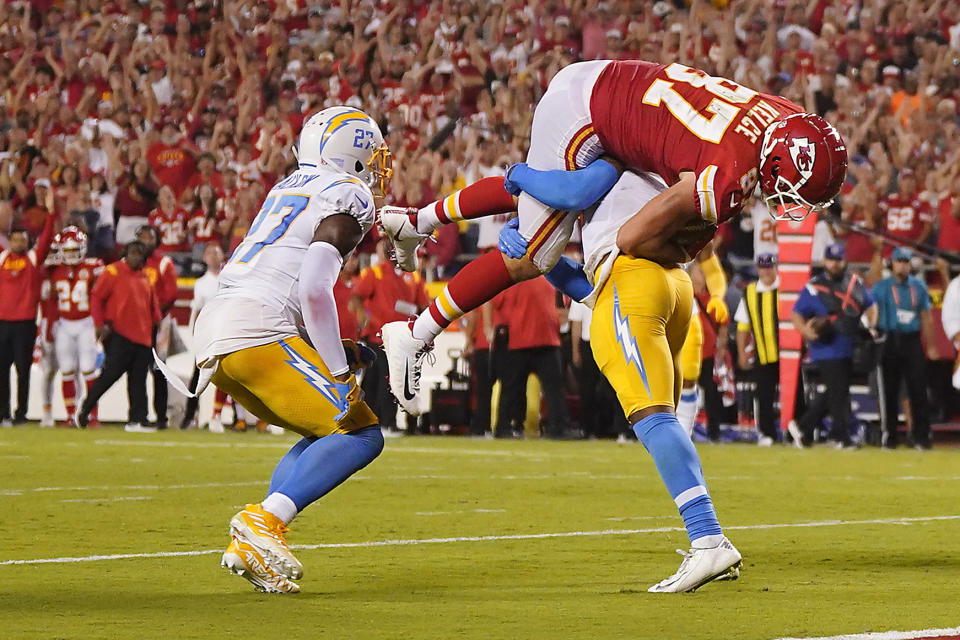 Sep 15, 2022; Kansas City, Missouri, USA; Los Angeles Chargers safety Derwin James Jr. (3) brings down Kansas City Chiefs tight end Travis Kelce (87) during the second half at GEHA Field at Arrowhead Stadium. Mandatory Credit: Jay Biggerstaff-USA TODAY Sports