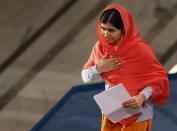 Nobel Peace Prize laureate Malala Yousafzai prepares to deliver her speech during the Nobel Peace Prize awards ceremony at the City Hall in Oslo December 10, 2014. Pakistani teenager Yousafzai, shot by the Taliban for refusing to quit school, and Indian activist Kailash Satyarthi received their Nobel Peace Prizes on Wednesday after two days of celebration honouring their work for children's rights. REUTERS/Suzanne Plunkett (NORWAY - Tags: SOCIETY)
