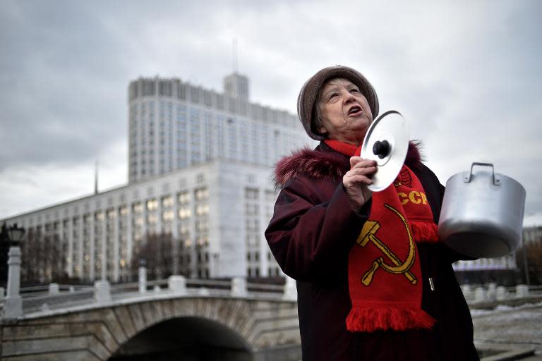 A Russian Communist Party supporter protests in December 2014 in front of government headquarters in Moscow over the state of the economy