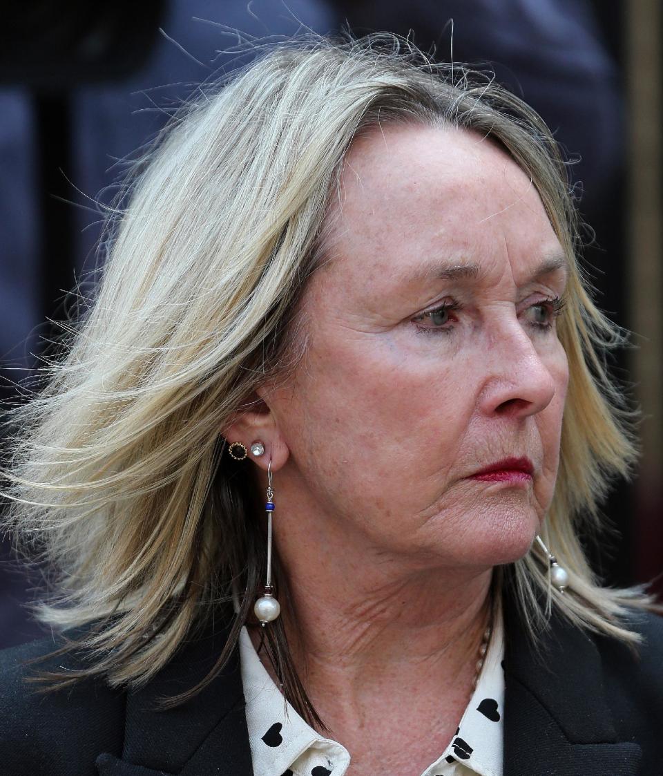 June Steenkamp, mother of Reeva Steenkamp, leaves after the court adjourned for the day in Pretoria, South Africa, Tuesday, May 6, 2014. Oscar Pistorius is charged with murder for the shooting death of his girlfriend, Reeva Steenkamp, on Valentines Day in 2013. (AP Photo/Themba Hadebe)