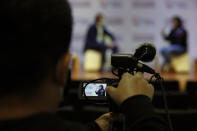 A cameraman films for live broadcast as Olimpia Coral Melo, who became an activist against online sexual harassment and assault after a video of her having sex was published online in 2013, speaks with Benito Juarez borough Mayor Santiago Taboada, in Mexico City, Monday, Nov. 23, 2020. Melo's story and subsequent activism have led to the creation of numerous state laws against cyber violence, and Mexico's government is on the verge of passing a federal version of "Olimpia's Law." (AP Photo/Rebecca Blackwell)