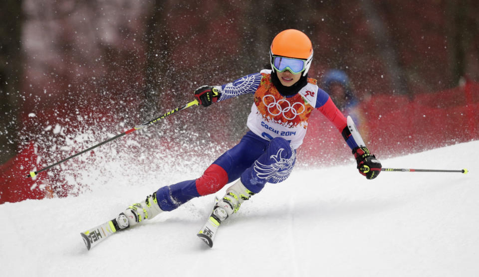 Violinst Vanessa Mae, starting under her father's name as Vanessa Vanakorn for Thailand, makes a turn in the first run of the women's giant slalom at the Sochi 2014 Winter Olympics, Tuesday, Feb. 18, 2014, in Krasnaya Polyana, Russia. (AP Photo/Charles Krupa)