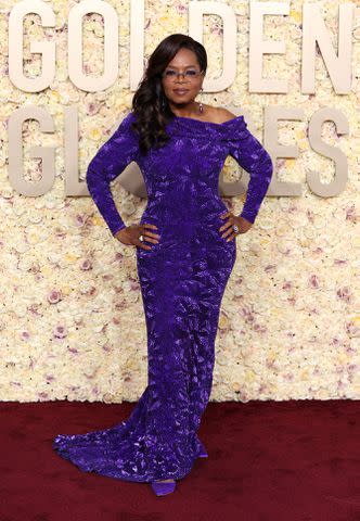 <p>Kevin Mazur/Getty </p> Oprah Winfrey at the 2024 Golden Globes