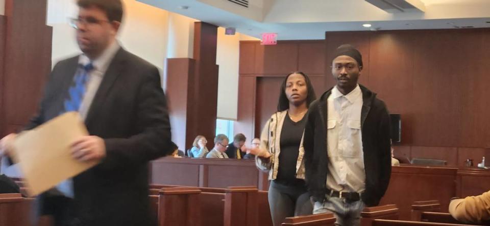 Dennis Leon Williams Jr., right, walks out of a Wake County courtroom on Wednesday, May 15, 2024, after pleading guilty to five counts of obstruction of justice related to him falsely claiming men sold him heroin while he was a confidential informant for Raleigh police.