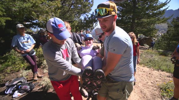 PHOTO: No Barriers volunteers carry Melissa Simpson, a woman with cerebral palsy, to the top of a mountain. (ABC News)