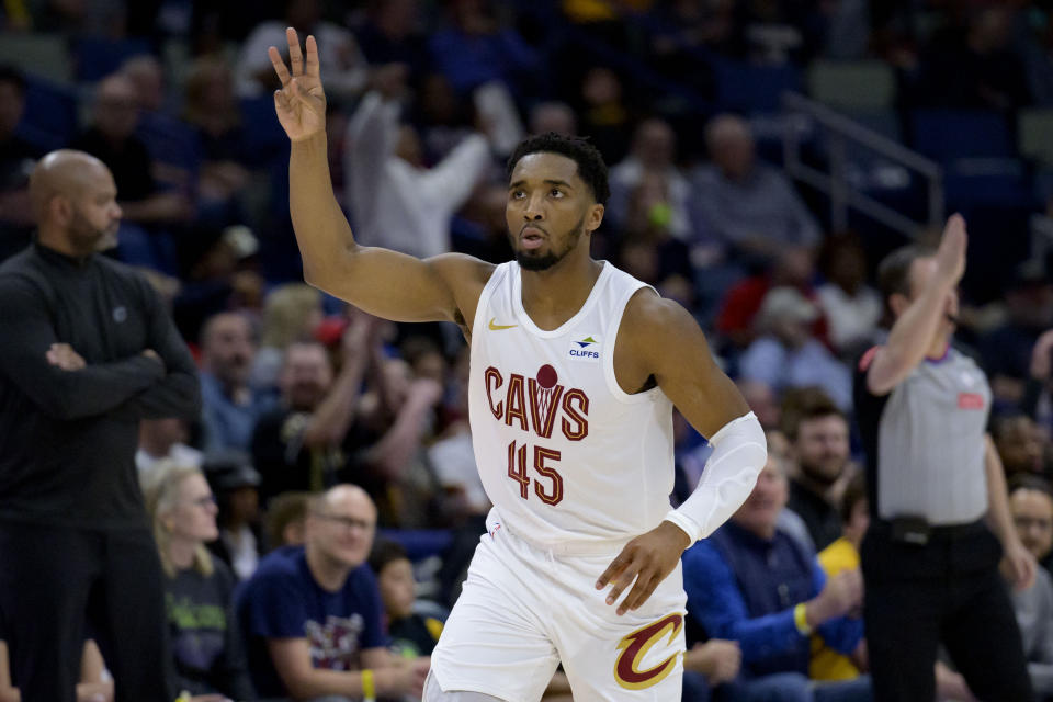 FILE - Cleveland Cavaliers guard Donovan Mitchell (45) celebrates a three point basket during the first half of an NBA basketball game against the New Orleans Pelicans in New Orleans, Wednesday, March 13, 2024. Cavaliers owner Dan Gilbert is confident All-Star guard Donovan Mitchell will sign a long-term contract to chase an NBA championship with Cleveland. “We’ve been talking to him, sure, for the last couple of years about extending this contract,” Gilbert said Thursday, March 28, in an interview with The Associated Press.(AP Photo/Matthew Hinton, File)